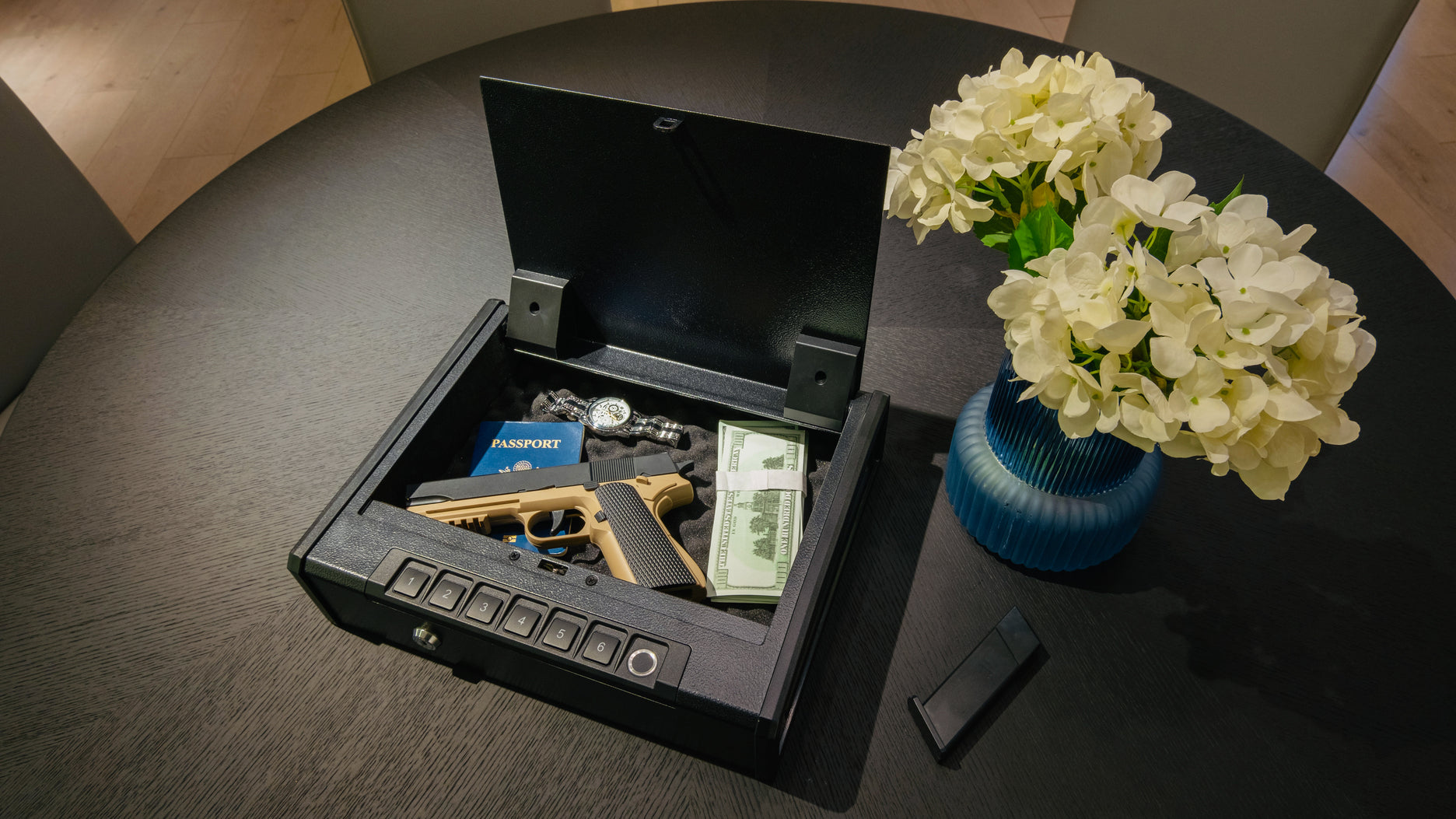 portable handgun safe on a black wooden table