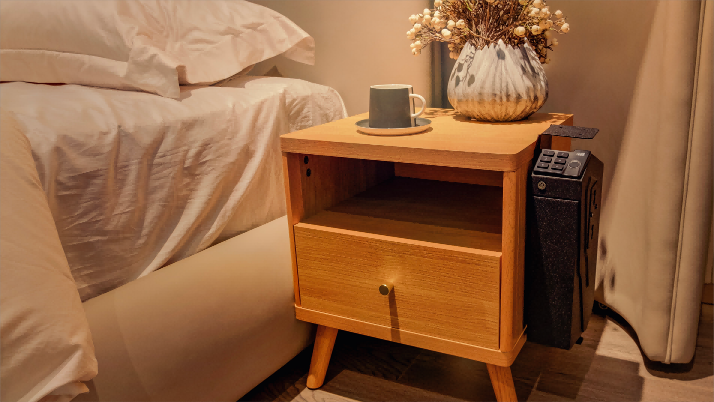 bedside pistol safe in a bedroom